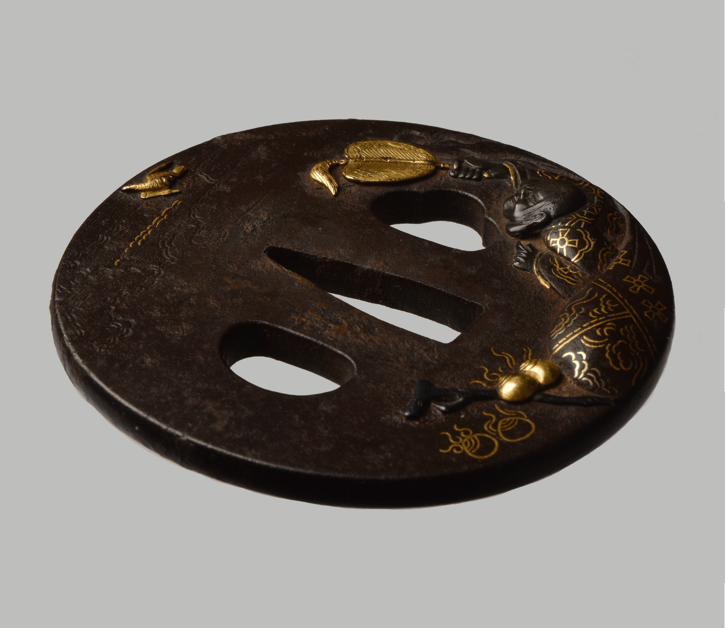 Tsuba - Mito - 水戸 仙人図(馬師皇) - Hotei with bird - shakudo, gold and silver