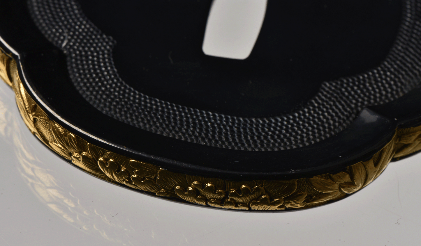 Tsuba with Black Lacquered Surface and Gilded Rim Decoration
